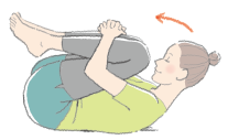 画像:両膝を抱えて頭を付けるように丸まっている女性